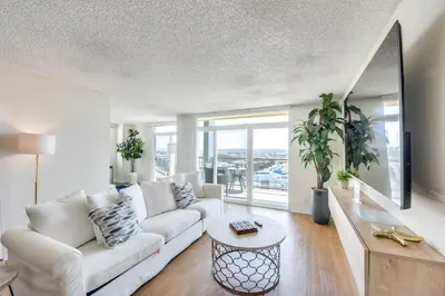 a living room with a white couch and a table at Marina Life: Smell the Sea, Feel the Breeze in Los Angeles