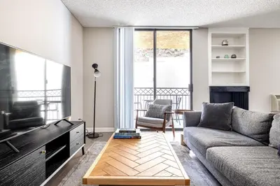 a living room with a couch and a tv at Westwood 1BR w Gym Pool Spa nr UCLA LAX-265 in Los Angeles