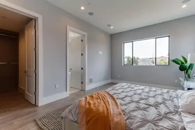 a bedroom with a large bed and a window at Luxury Modern 4 Bedroom 4 Bathroom Home with Rooftop Deck #4 in Los Angeles