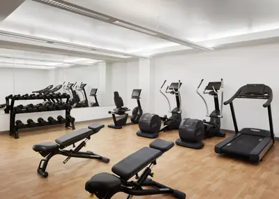 a room with a bunch of exercise equipment in it at Pasadena Hotel & Pool in Pasadena