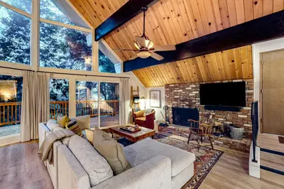 a living room with a couch and a fireplace at Pinecrest Paradise in Crestline