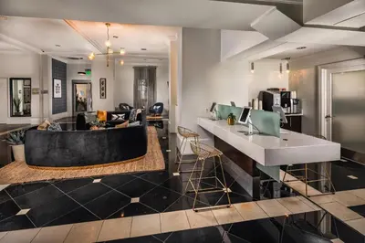 a lobby with a bar and a living room at Super Quiet Apartment In Full Service Bldg near UCLA in Los Angeles