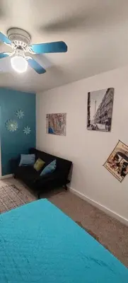 a living room with a couch and a ceiling fan at Private Guest Cozy Room w/Full Bathroom in Lake Isabella