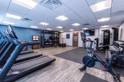 a gym with treadmills and ellipticals in a room at Hampton Inn & Suites Bakersfield Central in Bakersfield