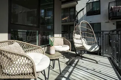 a group of chairs and a table on a balcony at Luxury 1BDR centrally located in Hollywood in Los Angeles