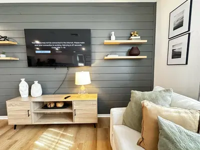 a living room with a tv and a couch at Claremont Colleges And Ontairo Mills Single Villa stay more 30 nights in Upland