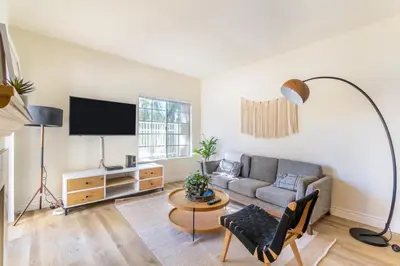 a living room with a couch and a tv at Thousand Oaks 2br near shopping dining bars LAX-1157 in Oak Park
