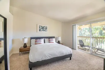 a bedroom with a large bed and a balcony at Thousand Oaks 2br near shopping dining bars LAX-1157 in Oak Park