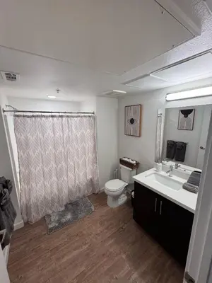 a bathroom with a toilet and a sink at Hollywood Universal Studios Apartment FREE parking in Los Angeles