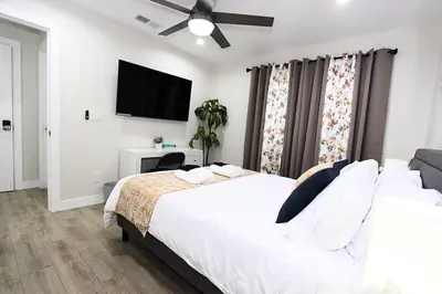 a bedroom with a bed and a flat screen tv at NEW! 2-Bedroom Fontana Guest House close to Kaiser Permanente in Fontana