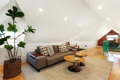 a living room with a couch and a table at Peace Palace 4803 in Los Angeles