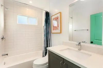 a bathroom with a sink and a tub and a toilet at Peace Palace 4803 in Los Angeles