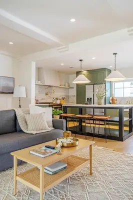 a living room with a couch and a table at New Home Universal sleeps 18 hot tub in Los Angeles