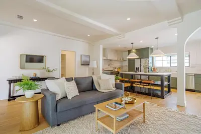 a living room with a couch and a kitchen at New Home Universal sleeps 18 hot tub in Los Angeles