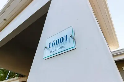 a sign on the side of a building at Lake Balboa 7 Bedroom 5 Bathroom Compound in Los Angeles