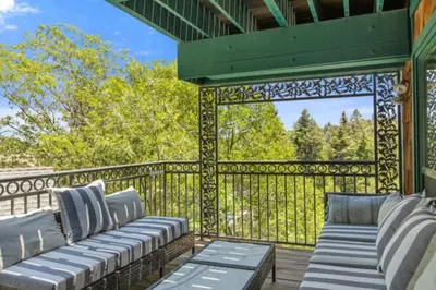 a gazebo with two couches on a deck at Lake Reflection Point Upscale Lake House 4 Bed and 4.5 Bath in Lake Arrowhead