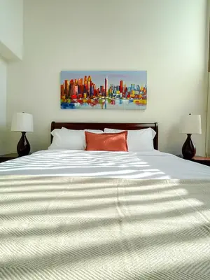 a bedroom with a large white bed with two lamps at *WEHO/Beverly Hills* Luxury 2BD/2.5BA + Balconies in Los Angeles