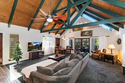 a living room with a couch and a ceiling at Large Comfy Family cabin-Great Kitchen, Pool Table, Pets welcome in Lake Arrowhead