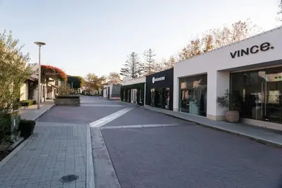 an empty street in front of a store at Malibu Sand Carbon Beach Suites in Malibu