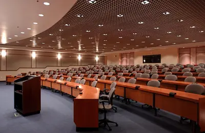 an empty lecture hall with desks and chairs at Villa Graziadio Executive Center at Pepperdine University in Malibu