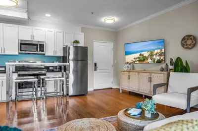 a kitchen and living room with a stainless steel appliance at Stylish in Sunny Santa Monica walk to Beach & Pier in Los Angeles
