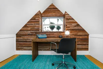 an attic office with a desk and a chair at Peace Palace 56 in Los Angeles