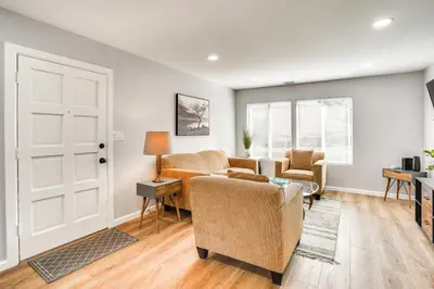 a living room with a couch and chairs and a table at Rental with Pool Access about 8 Mi to Disneyland in La Palma