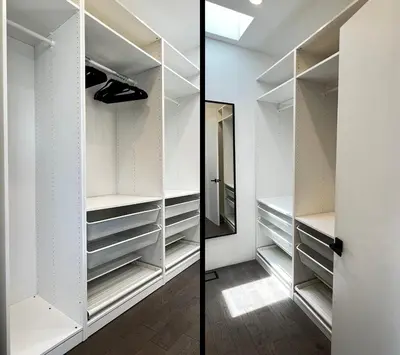 a walk in closet with white cabinets and a mirror at Luxurious Venice Oasis Home in Los Angeles