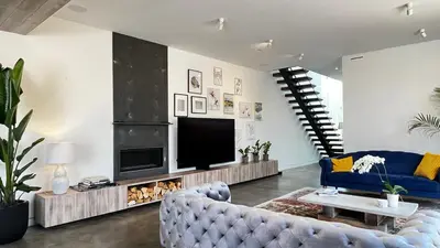 a living room with a couch and a television at Luxurious Venice Oasis Home in Los Angeles