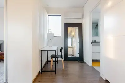 a hallway with a desk and a chair in a room at Cozy Luxerius 1 bed Loft Venice in Los Angeles