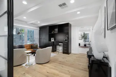 a living room with a couch and a table at Erwin Estate in Los Angeles