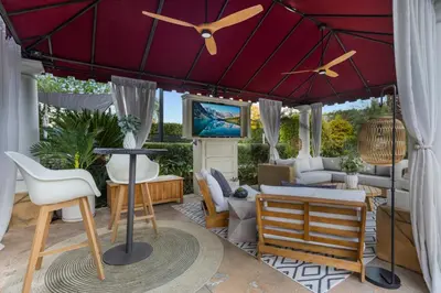a living room with a large purple umbrella at Erwin Estate in Los Angeles