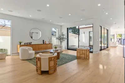a living room filled with furniture and a mirror at The Penmar Retreat - Luxurious resort-style oasis in Los Angeles