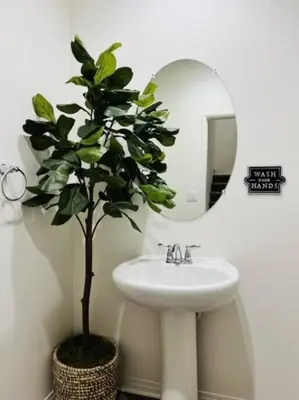 a bathroom with a sink and a potted plant at Up to 25% OFF / New Built for Ideal Extended Stay in Fontana