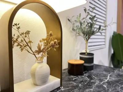a white vase on a shelf in front of a mirror at Up to 25% OFF / New Built for Ideal Extended Stay in Fontana