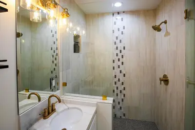 a bathroom with a sink and a shower at Steps 2 Beach- Luxury Home, Game Room, Roof Deck, Firepit, Pets OK in Oxnard