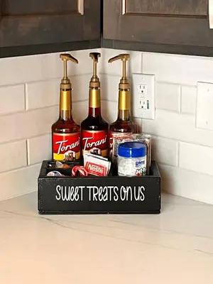 a shelf with four bottles of alcohol on a kitchen counter at Brand new Cabins in Kernville