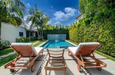 a swimming pool with two lounge chairs and a house at Beautiful Large 3 Bedroom 2 Bath Plus Pool and Jacuzzi in Los Angeles
