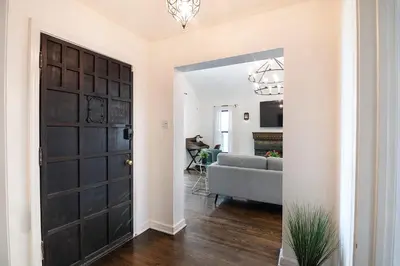 a hallway with a door leading to a living room at Beautiful Large 3 Bedroom 2 Bath Plus Pool and Jacuzzi in Los Angeles