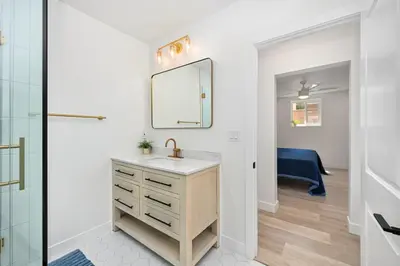 a bathroom with a sink and a mirror at Sunset Beach Retreat next to Water Tower and Ocean in Sunset Beach