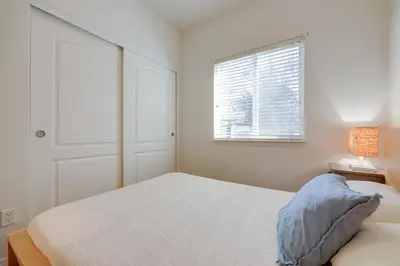 a white bedroom with a bed and a window at Cozy Oak View Getaway about 5 Mi to Ojai Valley! in Oak View