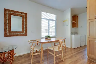 a dining room with a table and chairs and a mirror at Charming Oak View Retreat about 5 Mi to Ojai Valley! in Oak View