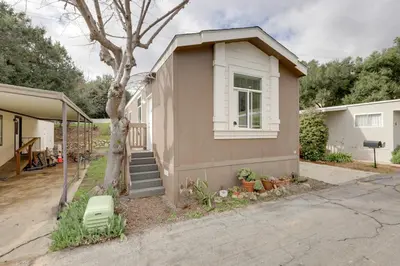 a small house with a tree in front of it at Oak View Vacation Rental about 3 Mi to Lake Casitas! in Oak View