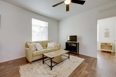 a living room with a couch and a table at Oak View Home with Private Covered Patio! in Oak View