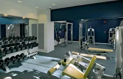 a gym with several treadmills and machines at Sunny Condo with Panoramic Ocean Views in Los Angeles