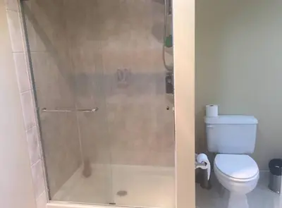 a bathroom with a shower with a toilet at Partial Ocean View Steps to the Pier in Los Angeles