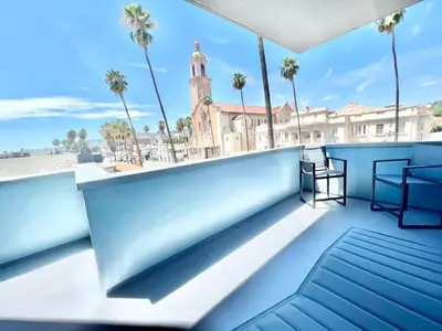 a view from the balcony of a building with palm trees at Large Hollywood Corner 2 Bedroom with Private Balcony in Los Angeles