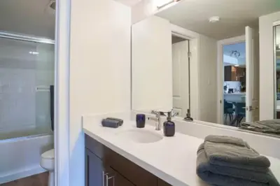 a bathroom with a sink and a mirror at Blue Agate - Seaside Bright 2BR with Marina Views in Los Angeles