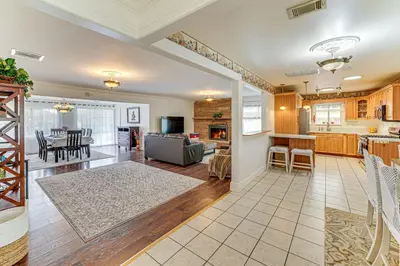 a living room and kitchen with a couch and a table at Family-Friendly Loma Linda Retreat Walk to LLU in Loma Linda