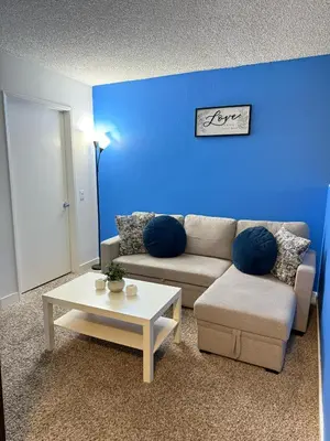 a living room with a couch and a table at Hollywood Blvd Studio FREE DESIGNATED PARKING & WIFI in Los Angeles